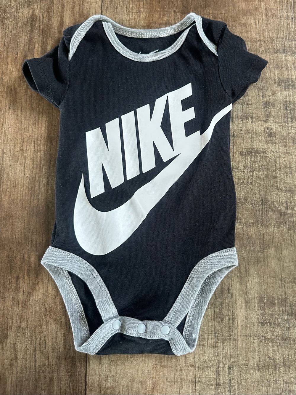 Nike swoosh onesie bodysuit